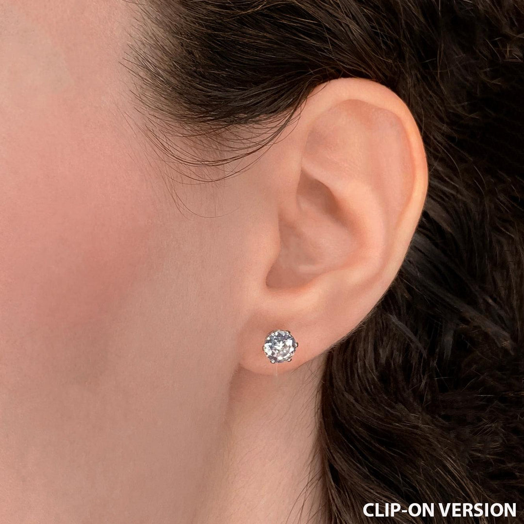 Medium rhinestone stud clip on earrings in silver worn on the ear with cubic zirconia stones