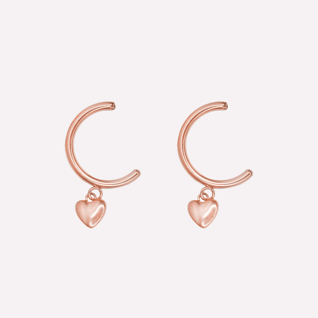 Thin huggie hoop with dangling heart charm clip on earrings in rose gold