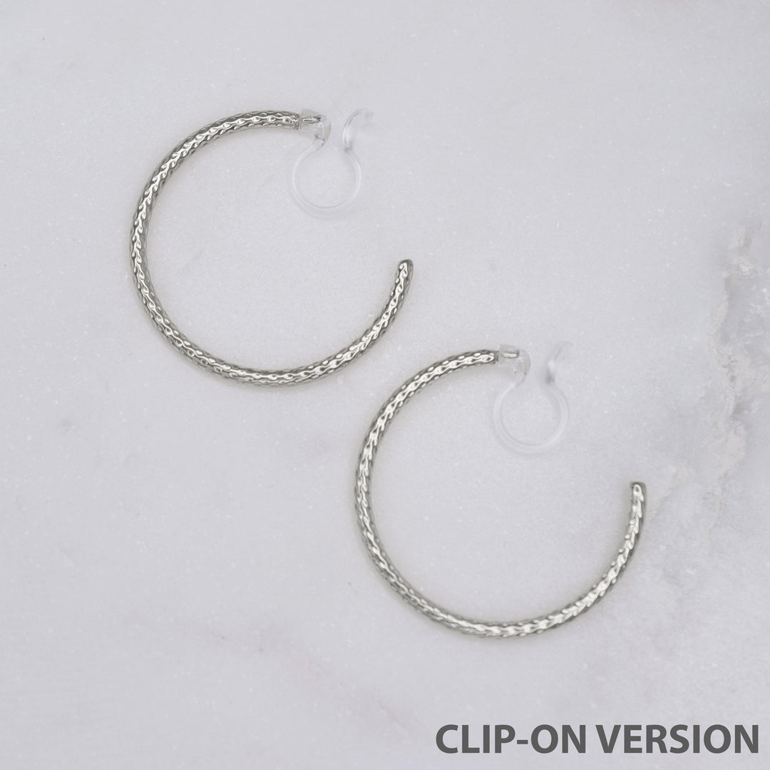 Medium textured hoop clip on earrings in silver