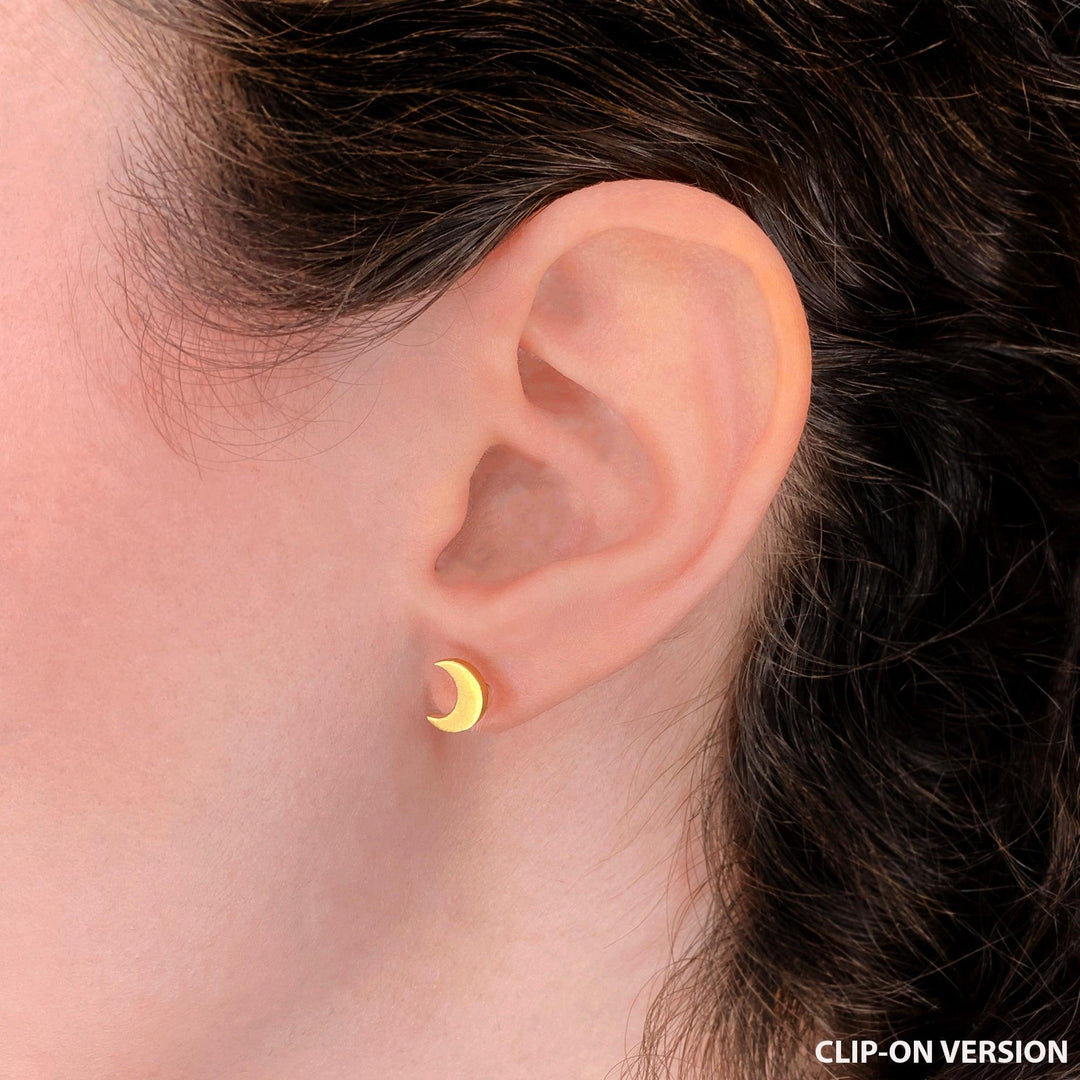 Moon stud clip on earrings in gold on the ear