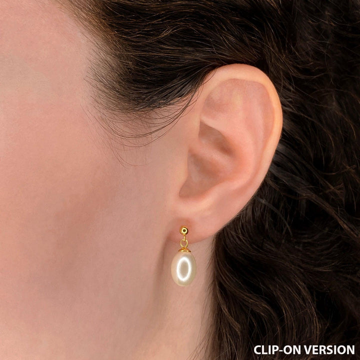Pearl dangle drop stud clip on earrings in gold on the ear
