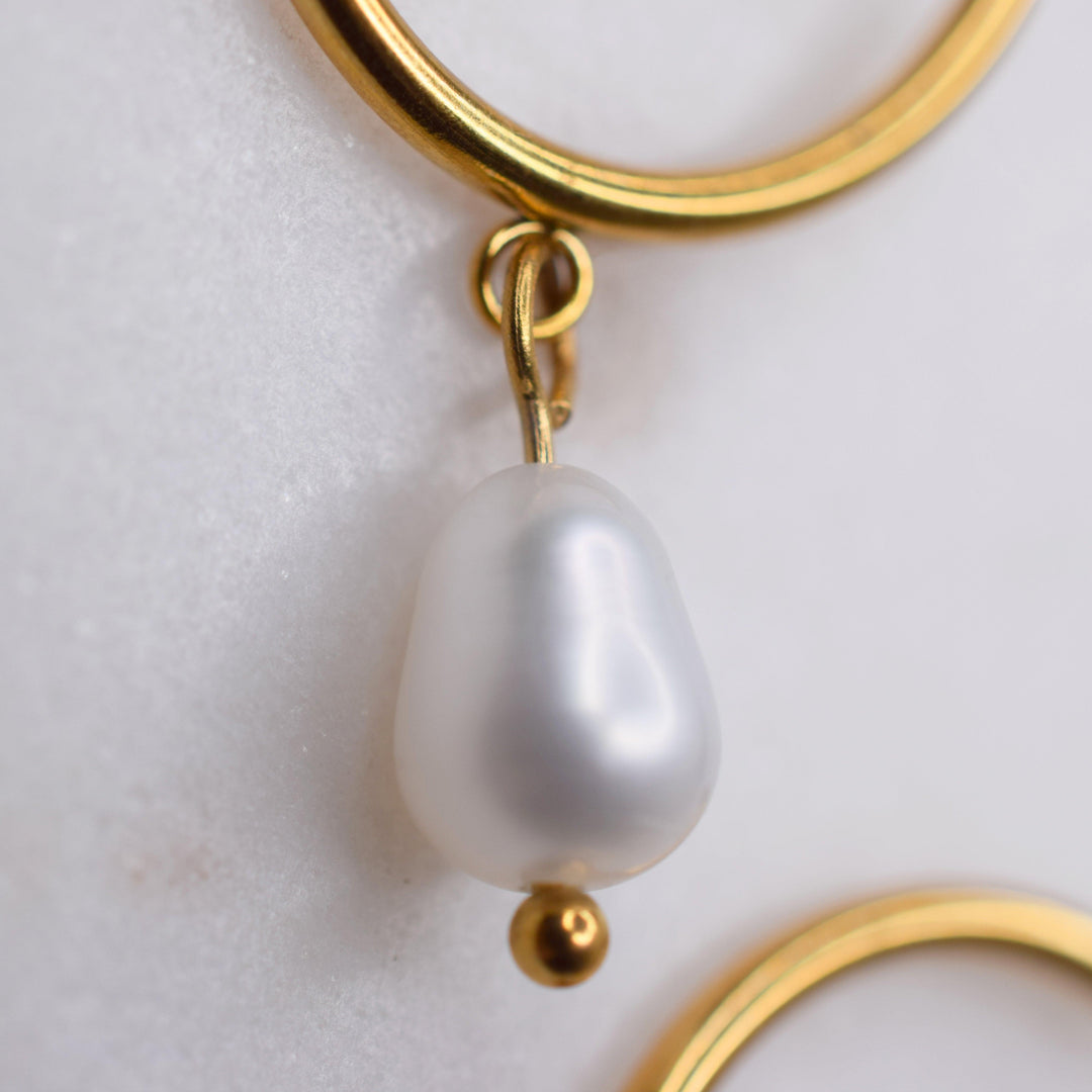 Closeup of the real genuine freshwater pearls that dangle from these clip on hoops