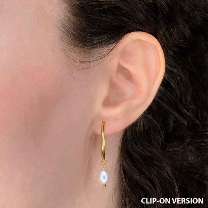 Thin small hoop clip on earrings in gold with real genuine freshwater pearl dangle worn on ear