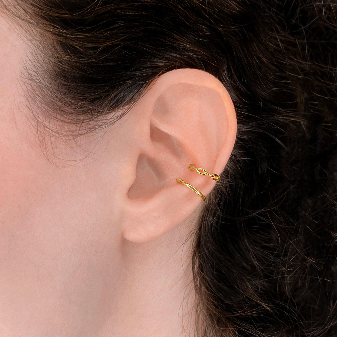 Plain ear cuff in gold and chain ear cuff on the ear as comfortable additional fake conch piercings