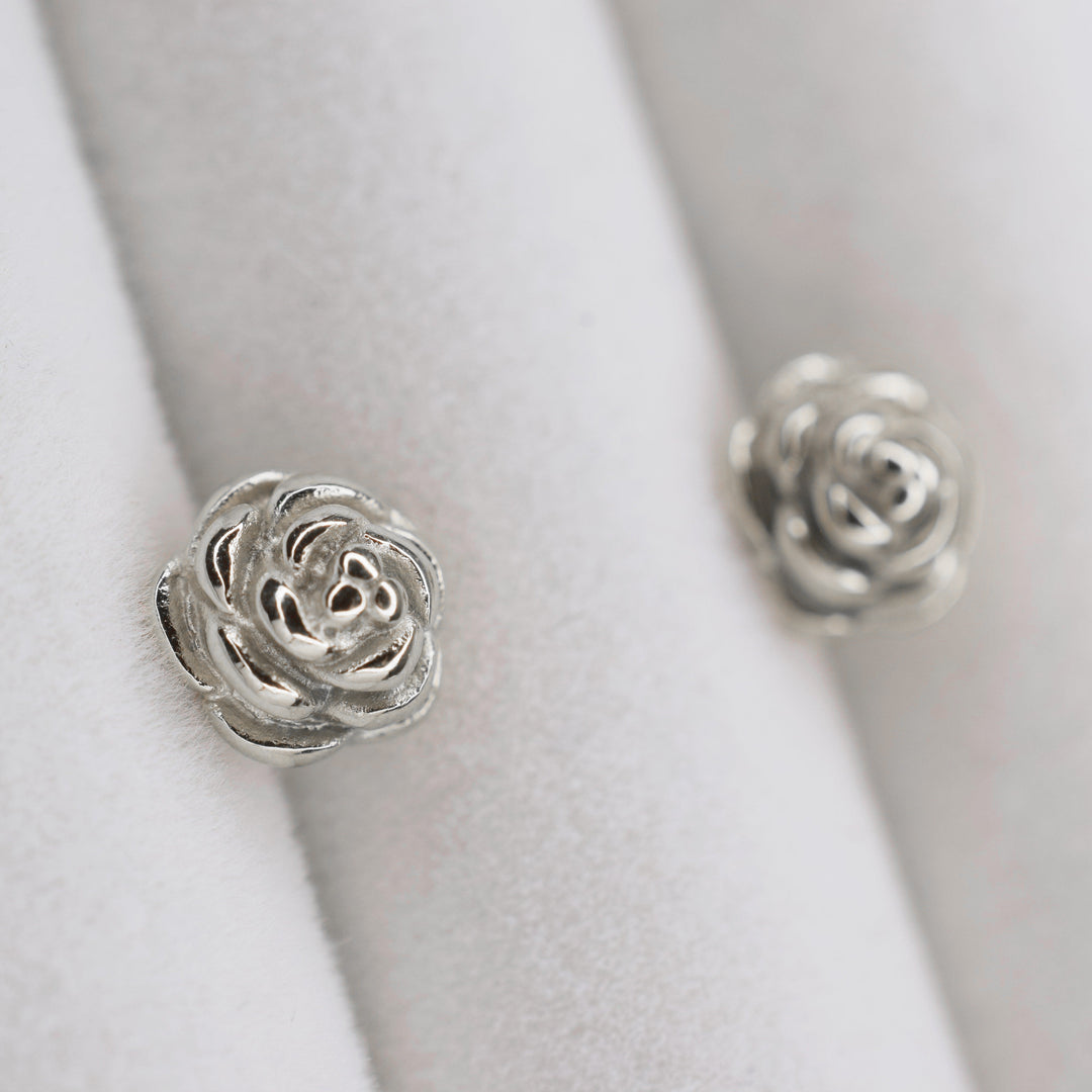 Rose stud clip on earrings in silver