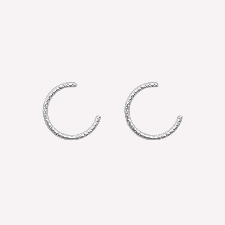 Thin small textured hoop clip on earrings in silver
